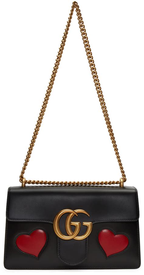 black gucci purse with heart